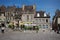 Street restaurants, cafes and fountain outside the Cathedral in Autun, Burgundy, France