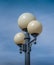 A street round lantern on a beautiful blue sky background