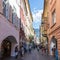 Street scenario of Laubengasse in the main District of Meran with many pedestrians. Merano. Province Bolzano, South Tyrol, Italy.