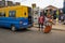 Street scene in the city of Bissau with people exiting a public bus Toca Toca at the Bandim Market, in Guinea-Bissau