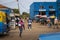 Street scene in the city of Bissau with people exiting a public bus Toca Toca at the Bandim Market, in Guinea-Bissau