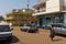 Street scene in the city of Bissau with a woman carrying a tray with bananas on her head, in Guinea Bissau