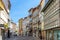 street scene in the old town of Braga with historic facades and people in early morning