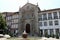 Street scene in the old town, water fountain in Largo da Misericordia, Guimaraes, Portugal