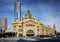 street scene outside flinders street station in central melbourne australia