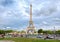 Street scene in Paris with traffic next to the Eiffel Tower