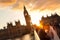 Street scene of random people on Westminster Bridge in sunset, London, UK.