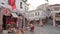 Street scene with souvenir shops in old town of Gjirokaster in Albania.