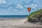 Street sign on a empty road with sea and sky in background. no entry. wrong way