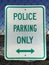 Street sign indicating Police parking only with arrows