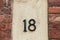 Street sign with number eighteen