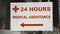 Street sign pointer with the inscription 24 Hours medical assistance