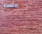 Street Sign on Red Brick Wall