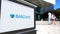 Street signage board with Barclays logo. Blurred office center and walking people background. Editorial 3D rendering