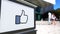 Street signage board with Facebook like button thumb up