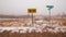 Street signs and arrows sign - cross-section of two rural gravel roads in Northern Wisconsin - cold snowy winter day in the gras