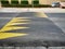 Street speed bump in the road for safety painted with yellow color