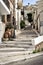 Street with stony steps at old town of Sitia town on Crete island, Greece