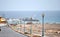 A street with street lamps leading to the ocean and the marina in Castillo Caleta de Fuste, Fuerteventura.