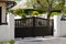 Street suburb portal home brown dark metal aluminum house gate garden access door