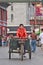 Street sweeper on an old tricycle in Beijing, China