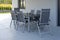 On the street terrace there are a gray table and six chairs made of metal and fabric, mounted on a tile. Beautiful modern romantic