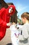 Street theatre. open street costumed performance of young actors. a child draws