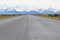 Street to Glacier National Park in El Chalten, Argentina, Patagonia with snow covered Fitz Roy Mountain in background