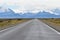 Street to Glacier National Park in El Chalten, Argentina, Patagonia with snow covered Fitz Roy Mountain in background