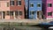 Street with traditional painted homes in Burano, Italy