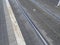 street tram line rails with grey pavement