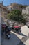 Street transport on the island of Symi, Greece. Old bicycle, moped and motorcycle on the background of the  cobblestone stairs.