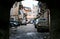 Street with typical Italian apartment buildings and shops in Palermo