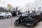 Street with various bicycles, cars and people in the island of Formentera, Spain