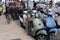 Street with various motorcycles, cars and people in the island of Formentera, Spain