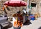Street vendor of fresh fruit, fresh juice and popcorn awaiting b