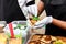 Street vendor hands making taco outdoors