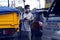 Street vendor sell cigarette, snack items and other items along a traffic congested road