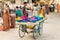 Street vendor sell colorful tika powders at street market of Puttaparthi, India