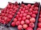 Street vendors: Boxes of ripe pomegranates on a snowy street, close-up