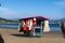 Street vendors carry their shop on the sand of Manzanillo Colima beach.