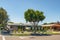 Street view and beautiful houses with nicely landscaped front the yard and clear blue sky background, California