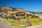 Street view, and beautiful houses with  nicely landscaped front the yard and mountains on background, California