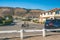 Street view, and beautiful houses with  nicely landscaped front the yard and mountains on background in Shell Beach, a small beach