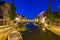 Street view on canals and monumental houses in historical city G