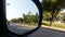 Street view from car side mirror