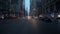 Street view of car traffic on the intersection in NYC. Slow motion of cars and taxi passing intersection in downtown New