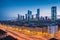 A street view of the City Life District during twilight is shot with a wide angle and a polarising filter.