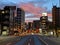 Street view completely empty road at dawn with buildings still lit up