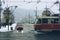 Street view of the crossroad with a tram and a car.